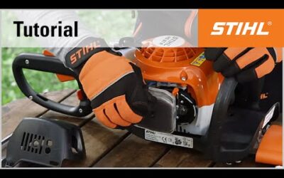 Cleaning the air filter of a STIHL petrol hedge trimmer